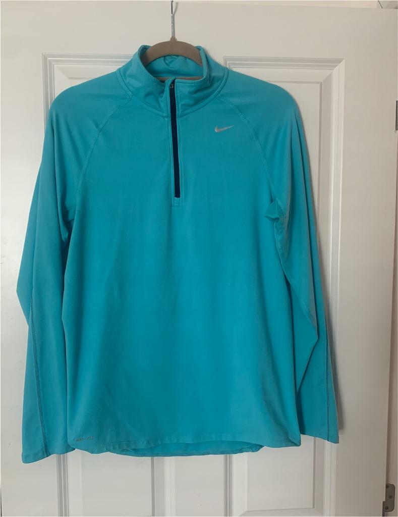 turquoise nike half zip